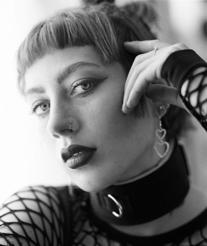 black and white film portrait of a girl looking into your eyes