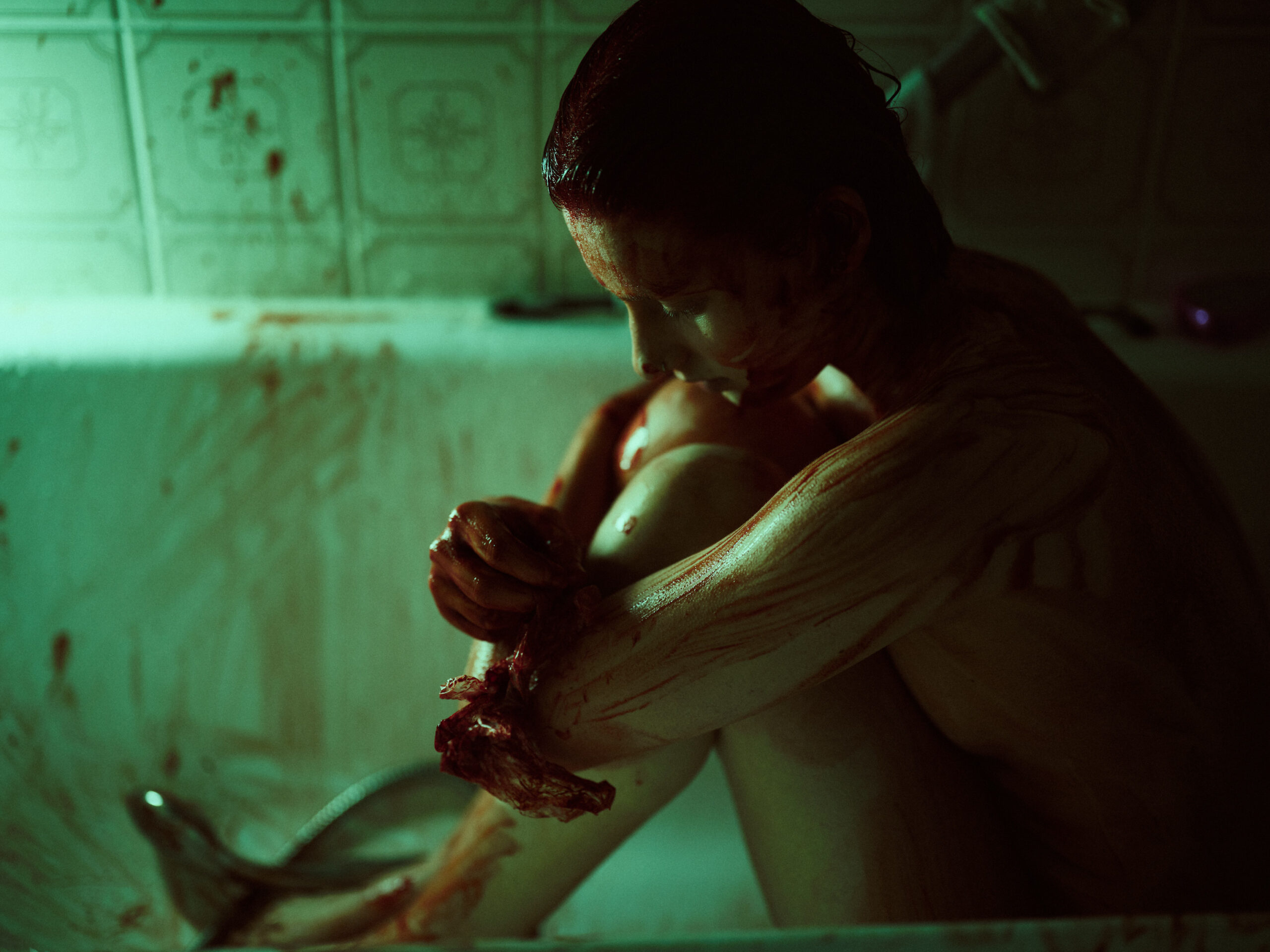 Girl in green light sitting in bath tub. Naked, drained in blood. Dark art by Dennis Gelner